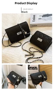 Detailed view of black quilted chain bag with silver twist lock and ball charm