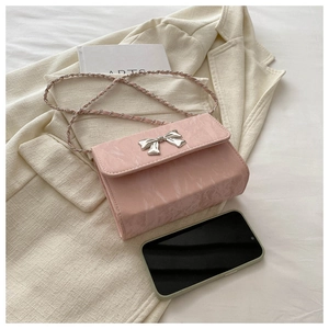 Pink marble pattern leather mini bag with silver butterfly buckle and phone for scale