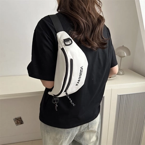 White minimalist canvas crossbody fanny pack with black strap and FANYISSA lettering