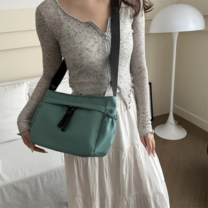 Morandi green large capacity Oxford fabric crossbody tote bag with adjustable black shoulder strap