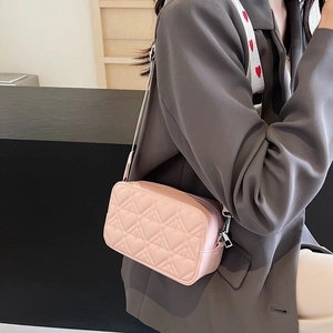 Pink heart-quilted crossbody bag with heart-print wide strap for women stylish outfit