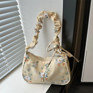 Floral yellow underarm bag with ruffled handle and summer flower patterns