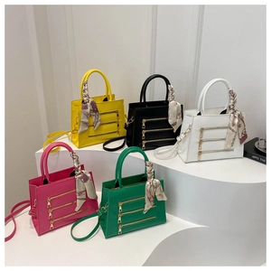Detailed display of five color options for top-handle bags with decorative scarves