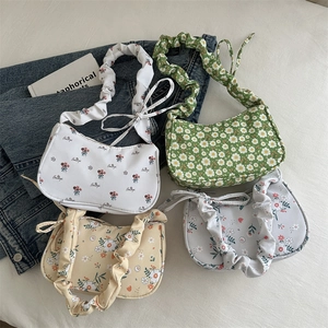 Floral crossbody bags with cloud-shaped pleat handles in four elegant colors