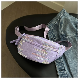 Light purple textured crossbody dumpling bag with colorful wave embroidery details