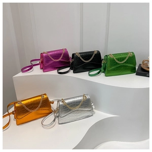 Mini crossbody bags with crocodile texture in metallic pink, green, orange, and silver