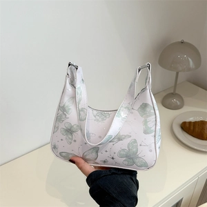 Chic butterfly print underarm bag in creamy white PU leather with crescent moon shape