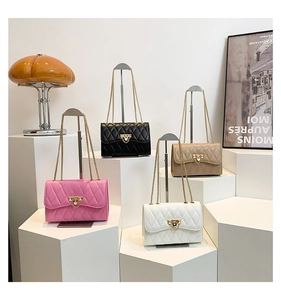 Quilted crossbody bags in pink, black, beige, and white with gold chain straps
