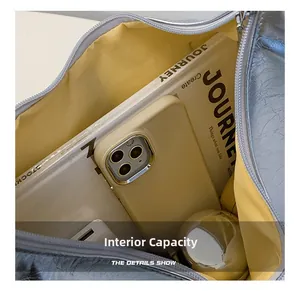 Macro shot of silver pleated tote bag interior with yellow lining and large capacity