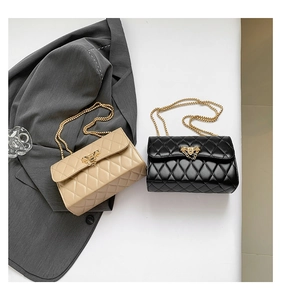Quilted crossbody bags in black and beige with gold chain straps and metal twist locks