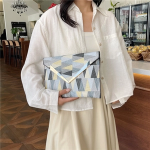Fashion geometric color-block envelope clutch bag with gold V-shape trim and top handle