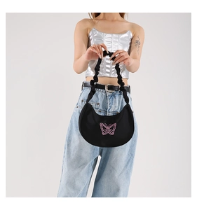 Close-up of black butterfly embroidered hobo bag with trendy ruched shoulder strap design