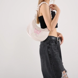 Y2K style off-white hobo bag with pink butterfly design and pleated shoulder strap
