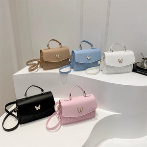 Quilted crossbody bag with butterfly clasp available in five elegant pastel colors