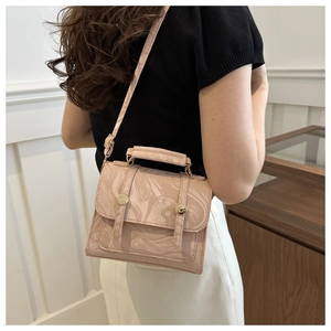 Close-up of pink marble pattern PU leather crossbody bag with metal circular buckle