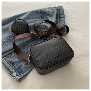 Close-up of retro plaid crossbody bag with adjustable wide strap and round coin purse pouch