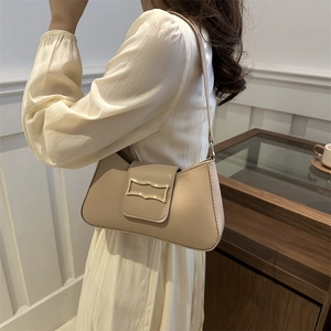 Chic beige faux leather underarm bag with gold metal buckle and slender shoulder strap