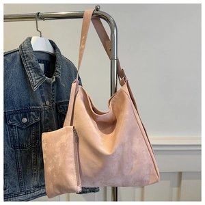 Detail of pink two-piece hobo tote bag set featuring washed PU leather texture and small pouch