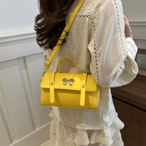 Bright yellow trendy small square crossbody bag for women with silver metal bow detail