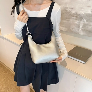 Chic silver half-moon tote bag with minimalist knot shoulder strap detail in soft PU leather