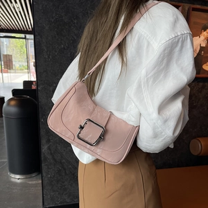 Minimalist light pink glossy leather underarm bag with decorative silver square buckle
