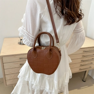 Brown apple-shaped crossbody bag in crocodile pattern leather with silver hardware