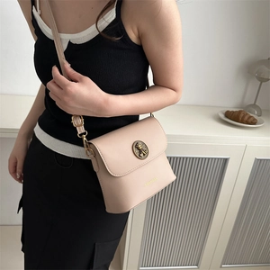 Chic beige leather crossbody bag with vintage metal buckle and slim shoulder strap