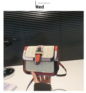 Detail showing woven texture and vibrant color block stitching on small square bag
