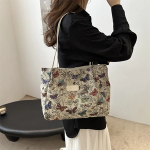 Minimalist large capacity tote bag featuring vibrant butterfly pattern jacquard texture