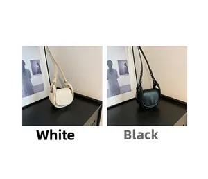 Side-by-side view of black and white mini saddle bags with adjustable straps