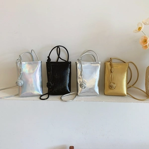 Minimalist crossbody phone bags in iridescent silver, black, gold, and metallic silver