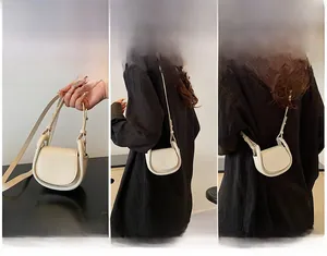 Three-way carry styles of cream leather half-moon bag: handbag, shoulder, and crossbody