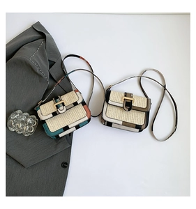 Detailed view of woven crossbody bags with bohemian patterns and gold H-buckle closures