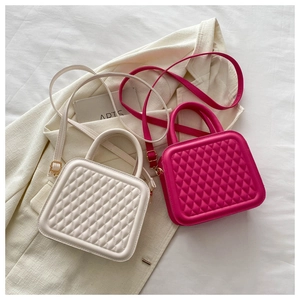Quilted crossbody bags in beige and rose red showing textured diamond pattern detailing