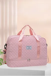 Pink quilted travel bag with double-layer design and separate bottom shoe compartment