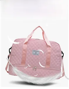 Detail of pink quilted travel bag showing dry-wet separation and lightweight fabric texture