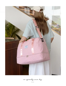Pink quilted travel bag featuring a bottom shoe compartment for gym and weekend trips