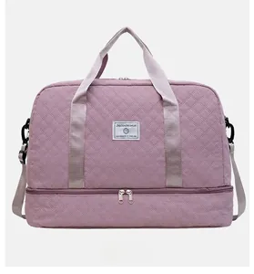 Detail view of purple quilted travel bag with large capacity and bottom shoe compartment