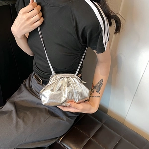 Chic silver pleated cloud crossbody bag for women with glossy metallic finish and strap