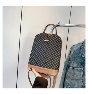Detail of printed leather backpack with JINGPIN metal plaque and dual zipper closure