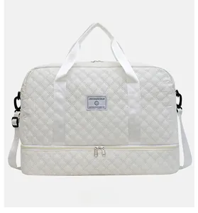 White quilted travel bag with large capacity and bottom shoe compartment