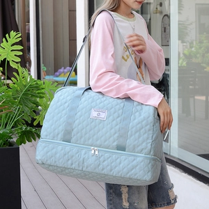 Light blue quilted travel bag with large capacity and double-layer design for sports