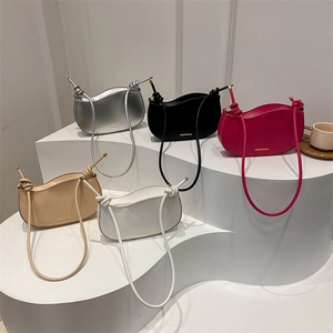 Minimalist half-moon underarm bags in five colors with knot straps and gold hardware details