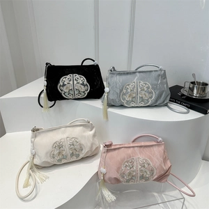 Embroidered crossbody bags set in four colors with traditional tassels and silk sheen