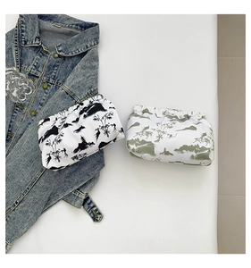 Detail of printed envelope clutch bags with traditional ink landscape art and ruched design