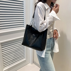 Large black woven shoulder tote bag with chain strap and fashion logo for women