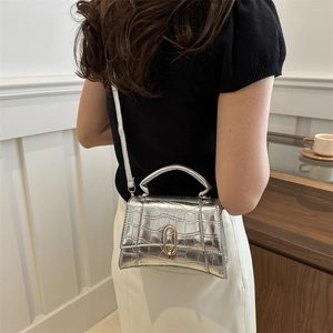 Silver metallic faux leather crossbody bag with crocodile pattern and top handle