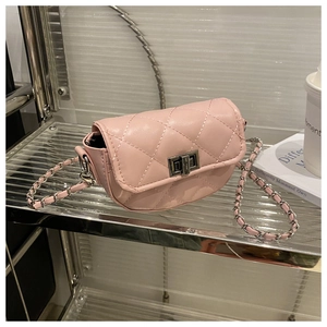 Detail of pink quilted leather shoulder bag with silver chain strap and metal clasp