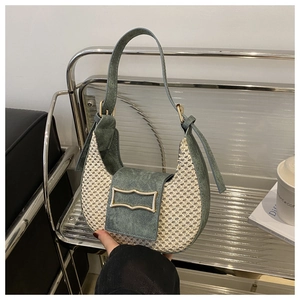 Close-up of woven mesh hobo bag in bean green with decorative golden square buckle