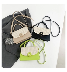 Three woven leather crossbody bags in beige, black, and green on grey blazer backdrop